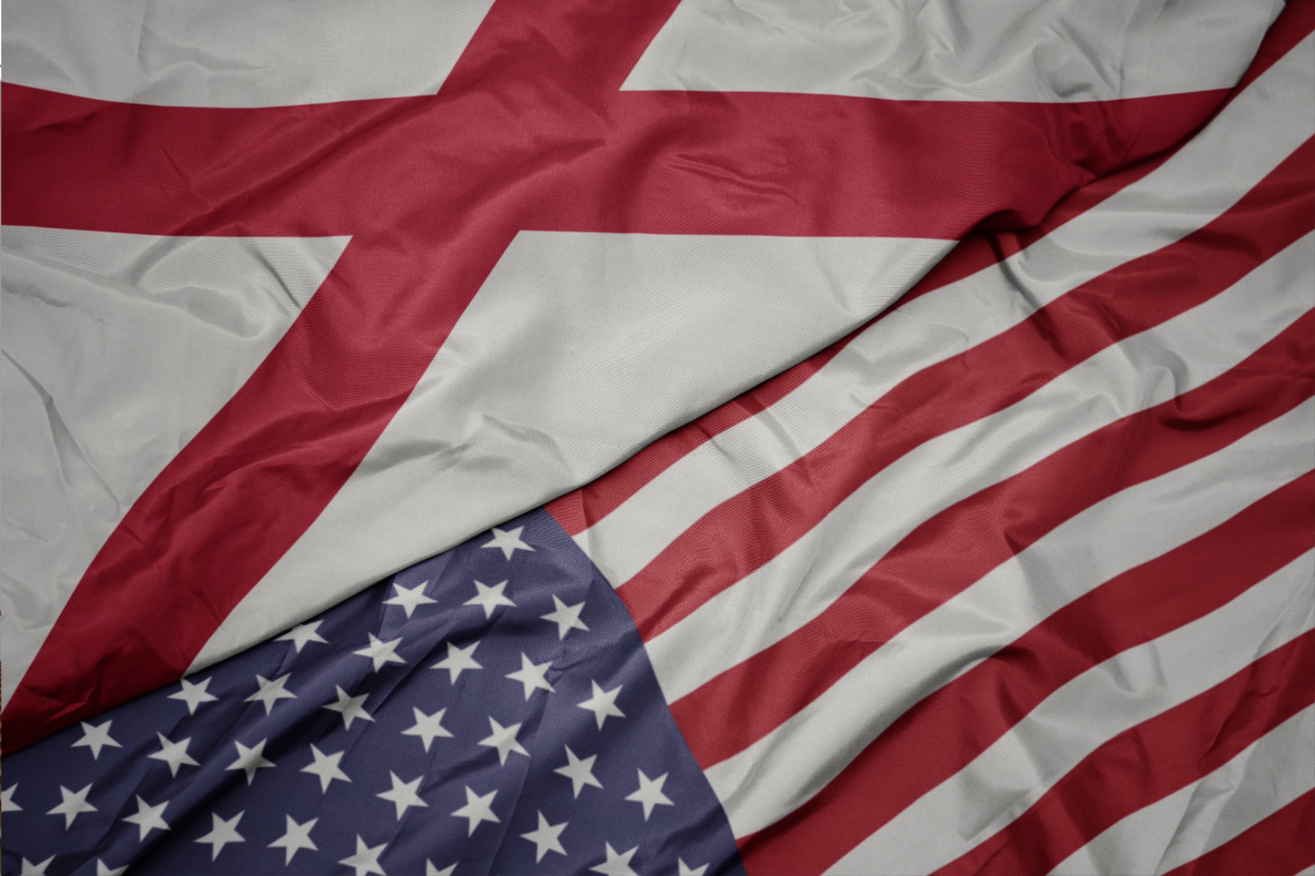 American and Alabama state flags waving together — Sweepers, a locally owned commercial cleaning company serving industries across Northeast Alabama