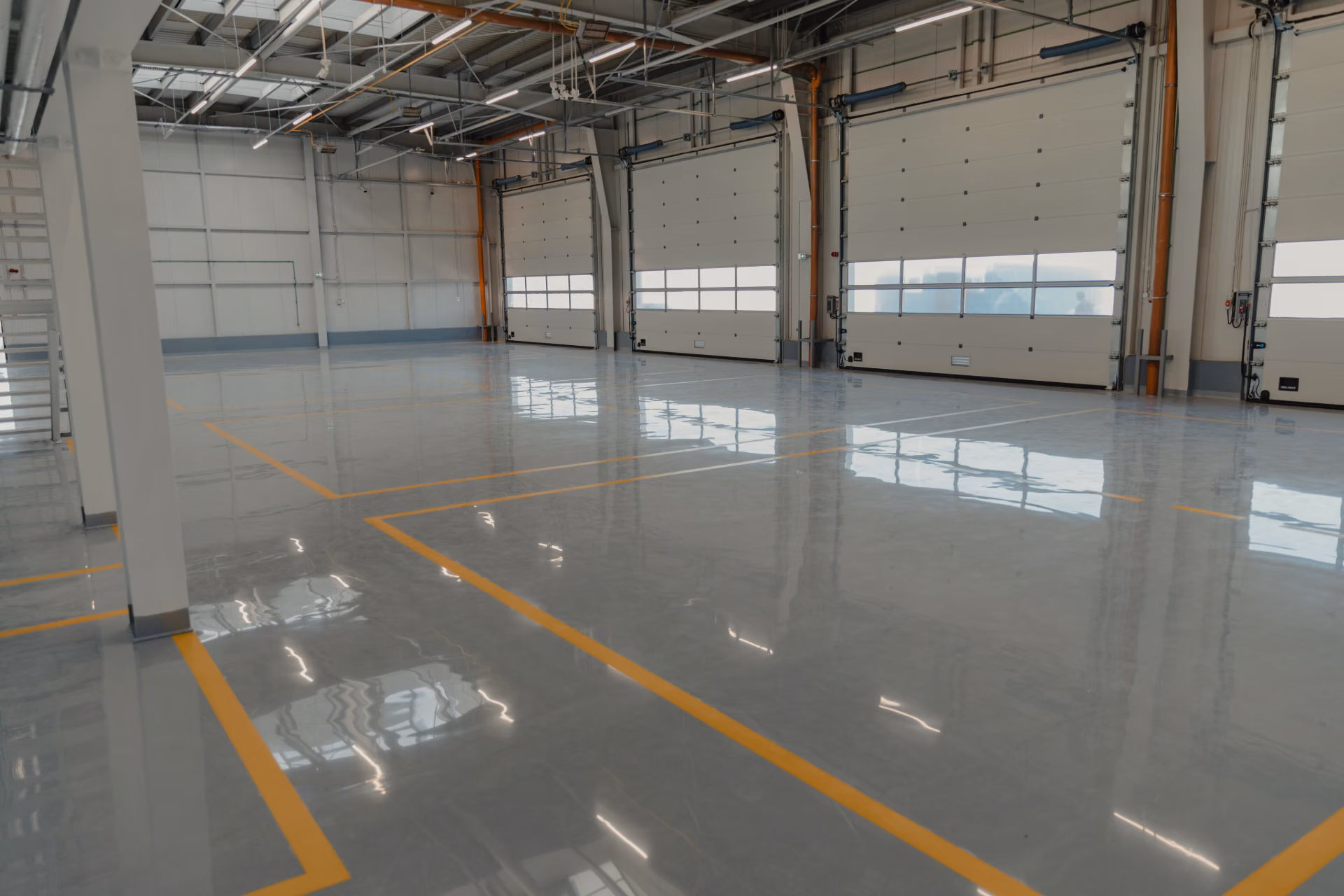 High-gloss polished commercial warehouse floor after professional strip, seal and wax cleaning service in Northeast Alabama